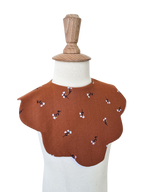 Bavoir fleuri terracotta